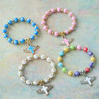 Pulsera con Dije de Cruz Alada: Oración Visual de Devoción y Conexión
