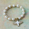 Pulsera con Dije de Cruz Alada: Oración Visual de Devoción y Conexión