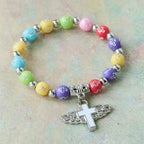 Pulsera con Dije de Cruz Alada: Oración Visual de Devoción y Conexión