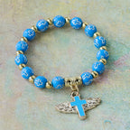 Pulsera con Dije de Cruz Alada: Oración Visual de Devoción y Conexión