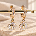 Our Lady Zircon Halo Huggie Earrings with Sunburst Medallion
