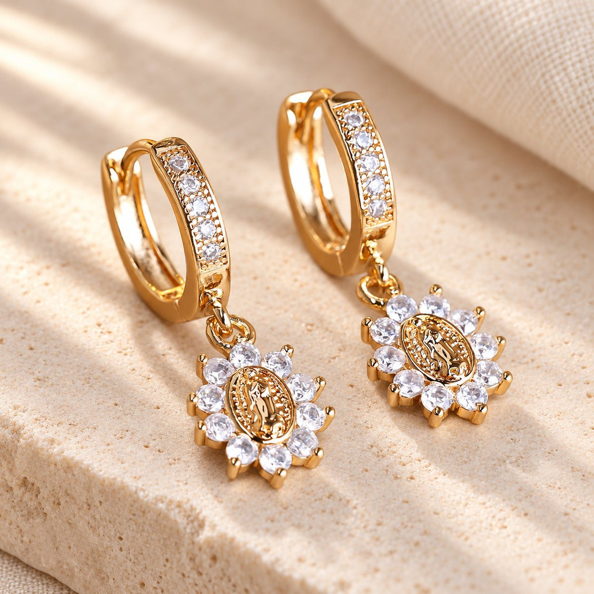 Our Lady Zircon Halo Huggie Earrings with Sunburst Medallion