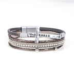 Pulsera de Cuero Multicapa "BENDECIDO" con Cruz y Circonia: Gracia Divina y Gozo Espiritual