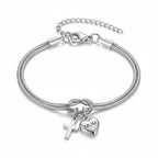 Pulsera Ajustable "Nudo de Amor" con Dije de Corazón y Cruz: Emblema de Devoción y Gracia
