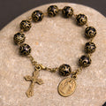 Pulsera Rosario Retro Negra con Medalla de San Benito y Crucifijo