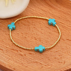 Pulsera de Cuentas de Turquesa con Cruz de Diseño Original